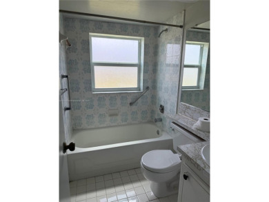 Fabulous 1st floor unit, corner unit, bright and beautiful.  55 on Sunrise Lakes Phase III in Florida - for sale on GolfHomes.com, golf home, golf lot