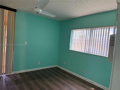 Fabulous 1st floor unit, corner unit, bright and beautiful.  55 on Sunrise Lakes Phase III in Florida - for sale on GolfHomes.com, golf home, golf lot