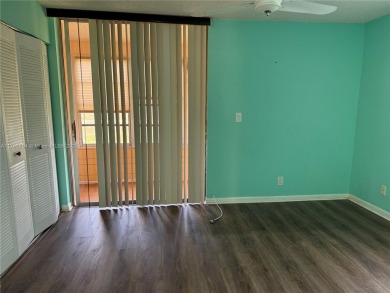 Fabulous 1st floor unit, corner unit, bright and beautiful.  55 on Sunrise Lakes Phase III in Florida - for sale on GolfHomes.com, golf home, golf lot