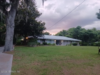 Stunning 4-bedroom 4 bath brick home with metal roof across from on Palatka Golf Club in Florida - for sale on GolfHomes.com, golf home, golf lot