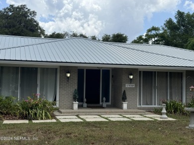 Stunning 4-bedroom 4 bath brick home with metal roof across from on Palatka Golf Club in Florida - for sale on GolfHomes.com, golf home, golf lot