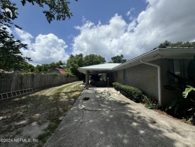 Stunning 4-bedroom 4 bath brick home with metal roof across from on Palatka Golf Club in Florida - for sale on GolfHomes.com, golf home, golf lot