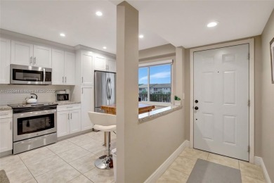 Impeccably upgraded fourth-floor unit featuring two bedrooms and on Flamingo Lakes Country Club in Florida - for sale on GolfHomes.com, golf home, golf lot