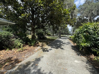 Stunning 4-bedroom 4 bath brick home with metal roof across from on Palatka Golf Club in Florida - for sale on GolfHomes.com, golf home, golf lot