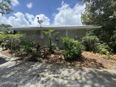 Stunning 4-bedroom 4 bath brick home with metal roof across from on Palatka Golf Club in Florida - for sale on GolfHomes.com, golf home, golf lot