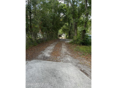 Stunning 4-bedroom 4 bath brick home with metal roof across from on Palatka Golf Club in Florida - for sale on GolfHomes.com, golf home, golf lot