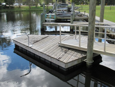 The upgrades look fantastic! NEW FLOORING on the main level; on River Bend Golf and Country Club in North Carolina - for sale on GolfHomes.com, golf home, golf lot