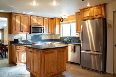 Furnished one level condo with attached garage on the golf on London Bridge Golf Course in Arizona - for sale on GolfHomes.com, golf home, golf lot