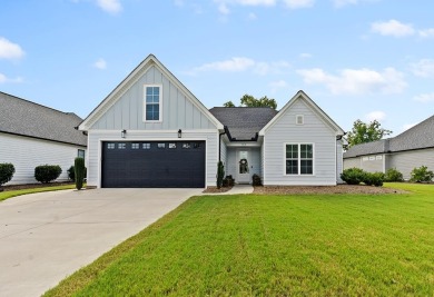 Welcome to 704 Swing About, a like-new custom home built in 2022 on The Links At Stoney Point in South Carolina - for sale on GolfHomes.com, golf home, golf lot