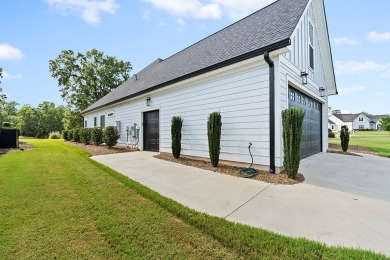 Welcome to 704 Swing About, a like-new custom home built in 2022 on The Links At Stoney Point in South Carolina - for sale on GolfHomes.com, golf home, golf lot
