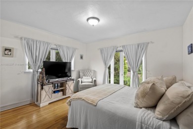 Welcome to an elegant sanctuary nestled beneath the majestic on Granada Golf Club in Florida - for sale on GolfHomes.com, golf home, golf lot