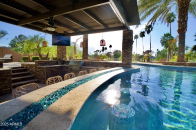 This tropical backyard oasis is a true showstopper! An oversized on Kokopelli Golf Course in Arizona - for sale on GolfHomes.com, golf home, golf lot