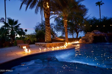 This tropical backyard oasis is a true showstopper! An oversized on Kokopelli Golf Course in Arizona - for sale on GolfHomes.com, golf home, golf lot