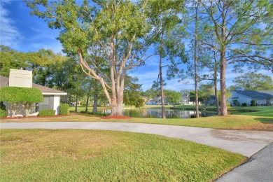 Discover this well-maintained 3-bedroom, 2.5-bath home on Cypresswood Golf and Country Club in Florida - for sale on GolfHomes.com, golf home, golf lot