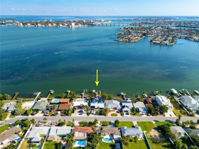 Secluded within the exclusive Boca Ciega Isle neighborhood, this on Isla Del Sol Yacht and Country Club in Florida - for sale on GolfHomes.com, golf home, golf lot