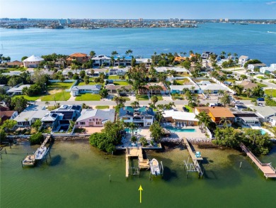 Secluded within the exclusive Boca Ciega Isle neighborhood, this on Isla Del Sol Yacht and Country Club in Florida - for sale on GolfHomes.com, golf home, golf lot