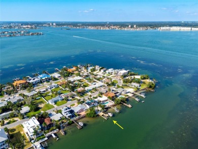 Secluded within the exclusive Boca Ciega Isle neighborhood, this on Isla Del Sol Yacht and Country Club in Florida - for sale on GolfHomes.com, golf home, golf lot