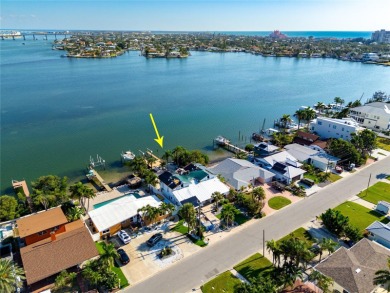 Secluded within the exclusive Boca Ciega Isle neighborhood, this on Isla Del Sol Yacht and Country Club in Florida - for sale on GolfHomes.com, golf home, golf lot