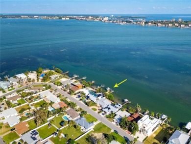 Secluded within the exclusive Boca Ciega Isle neighborhood, this on Isla Del Sol Yacht and Country Club in Florida - for sale on GolfHomes.com, golf home, golf lot