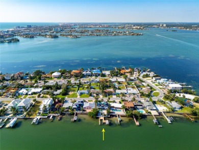 Secluded within the exclusive Boca Ciega Isle neighborhood, this on Isla Del Sol Yacht and Country Club in Florida - for sale on GolfHomes.com, golf home, golf lot