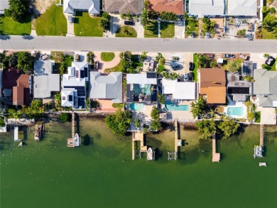 Secluded within the exclusive Boca Ciega Isle neighborhood, this on Isla Del Sol Yacht and Country Club in Florida - for sale on GolfHomes.com, golf home, golf lot