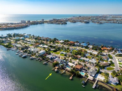 Secluded within the exclusive Boca Ciega Isle neighborhood, this on Isla Del Sol Yacht and Country Club in Florida - for sale on GolfHomes.com, golf home, golf lot