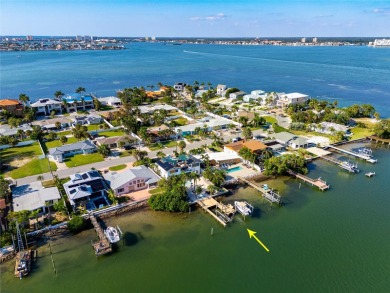 Secluded within the exclusive Boca Ciega Isle neighborhood, this on Isla Del Sol Yacht and Country Club in Florida - for sale on GolfHomes.com, golf home, golf lot