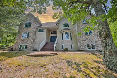 This Magnificent three level home has 9 substantial bedrooms and on Country Club of the Poconos Golf Course in Pennsylvania - for sale on GolfHomes.com, golf home, golf lot