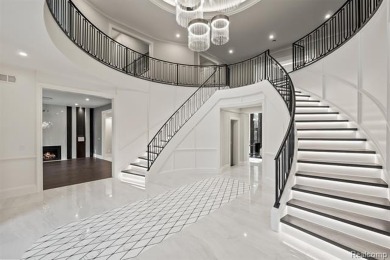 Set on over two acres along the coveted shores of all-sports on Orchard Lake Country Club in Michigan - for sale on GolfHomes.com, golf home, golf lot