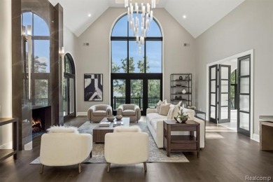 Set on over two acres along the coveted shores of all-sports on Orchard Lake Country Club in Michigan - for sale on GolfHomes.com, golf home, golf lot