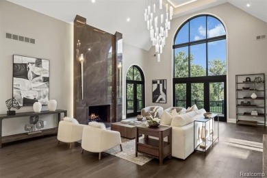 Set on over two acres along the coveted shores of all-sports on Orchard Lake Country Club in Michigan - for sale on GolfHomes.com, golf home, golf lot