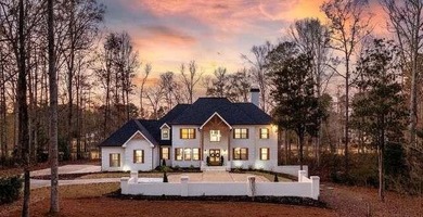 Welcome to a truly magnificent, all-brick, luxury estate in the on Whitewater Creek in Georgia - for sale on GolfHomes.com, golf home, golf lot