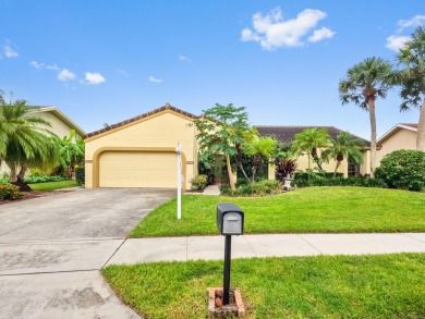 This stunning lakefront home in the highly desirable Elysium on Village Golf Club in Florida - for sale on GolfHomes.com, golf home, golf lot