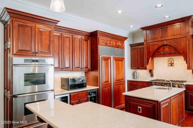 This exquisite brick home is tucked away on a cul-de-sac within on Pinewild Country Club of Pinehurst in North Carolina - for sale on GolfHomes.com, golf home, golf lot
