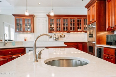 This exquisite brick home is tucked away on a cul-de-sac within on Pinewild Country Club of Pinehurst in North Carolina - for sale on GolfHomes.com, golf home, golf lot