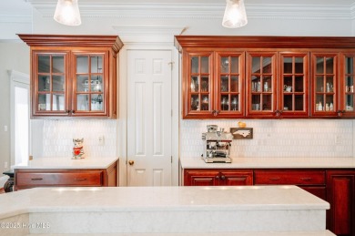 This exquisite brick home is tucked away on a cul-de-sac within on Pinewild Country Club of Pinehurst in North Carolina - for sale on GolfHomes.com, golf home, golf lot