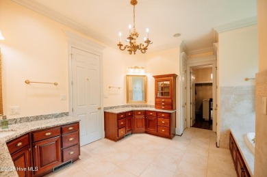 This exquisite brick home is tucked away on a cul-de-sac within on Pinewild Country Club of Pinehurst in North Carolina - for sale on GolfHomes.com, golf home, golf lot