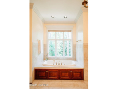 This exquisite brick home is tucked away on a cul-de-sac within on Pinewild Country Club of Pinehurst in North Carolina - for sale on GolfHomes.com, golf home, golf lot