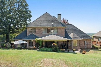 Welcome to this beautiful 4-bedroom, 2.5-bath home perfectly on Eagle Crest Golf Course in Arkansas - for sale on GolfHomes.com, golf home, golf lot