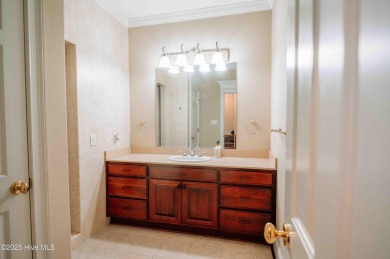 This exquisite brick home is tucked away on a cul-de-sac within on Pinewild Country Club of Pinehurst in North Carolina - for sale on GolfHomes.com, golf home, golf lot