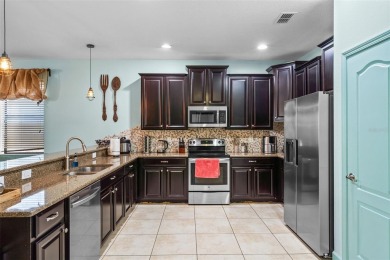 Step into the magical realm of this beautifully themed on The Oasis Club at Champions Gate in Florida - for sale on GolfHomes.com, golf home, golf lot