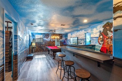 Step into the magical realm of this beautifully themed on The Oasis Club at Champions Gate in Florida - for sale on GolfHomes.com, golf home, golf lot