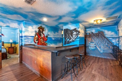 Step into the magical realm of this beautifully themed on The Oasis Club at Champions Gate in Florida - for sale on GolfHomes.com, golf home, golf lot