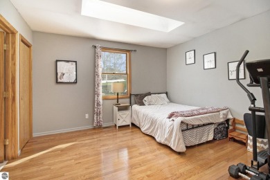 Discover comfort and convenience in this well-maintained on Bear Lake Highlands Golf Course in Michigan - for sale on GolfHomes.com, golf home, golf lot
