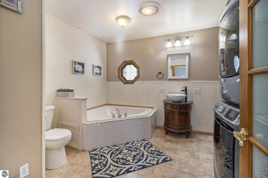 Discover comfort and convenience in this well-maintained on Bear Lake Highlands Golf Course in Michigan - for sale on GolfHomes.com, golf home, golf lot