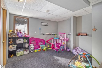Discover comfort and convenience in this well-maintained on Bear Lake Highlands Golf Course in Michigan - for sale on GolfHomes.com, golf home, golf lot