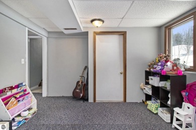 Discover comfort and convenience in this well-maintained on Bear Lake Highlands Golf Course in Michigan - for sale on GolfHomes.com, golf home, golf lot
