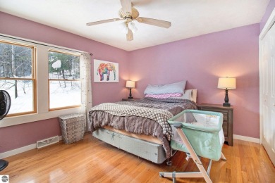 Discover comfort and convenience in this well-maintained on Bear Lake Highlands Golf Course in Michigan - for sale on GolfHomes.com, golf home, golf lot