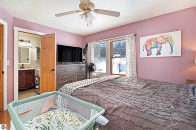Discover comfort and convenience in this well-maintained on Bear Lake Highlands Golf Course in Michigan - for sale on GolfHomes.com, golf home, golf lot