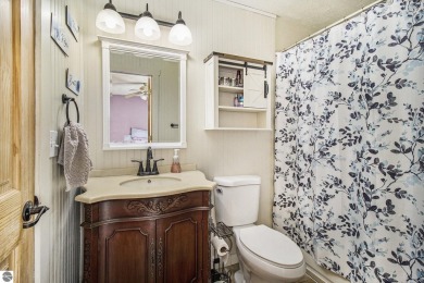 Discover comfort and convenience in this well-maintained on Bear Lake Highlands Golf Course in Michigan - for sale on GolfHomes.com, golf home, golf lot